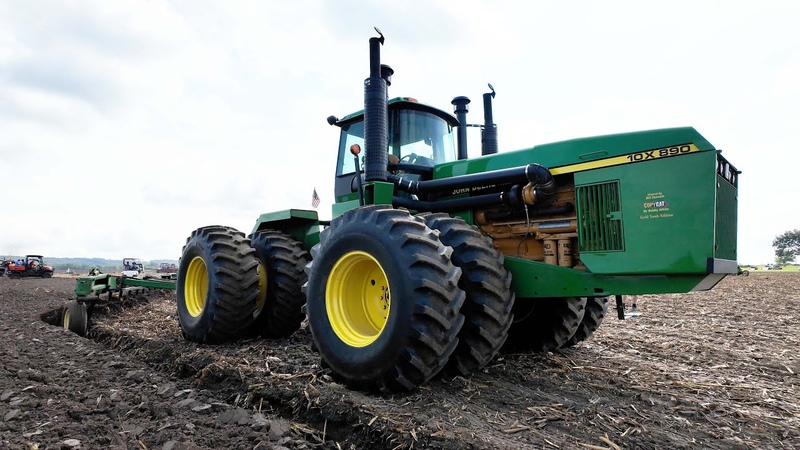 Big Tractors Plowing at 100 Years of