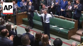 UK lawmaker returns to work after losing his hands, feet to sepsis